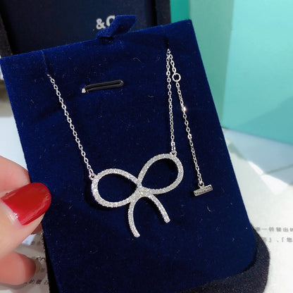 [Regalia Jewels]CLAW SET RHODIUM PLATED BOW NECKLACE