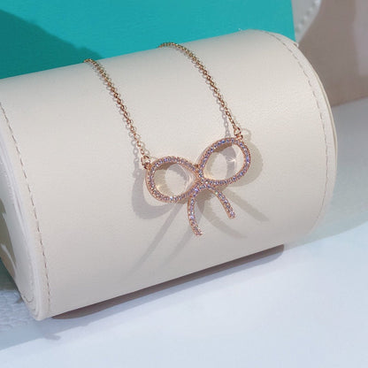 [Regalia Jewels]CLAW SET RHODIUM PLATED BOW NECKLACE