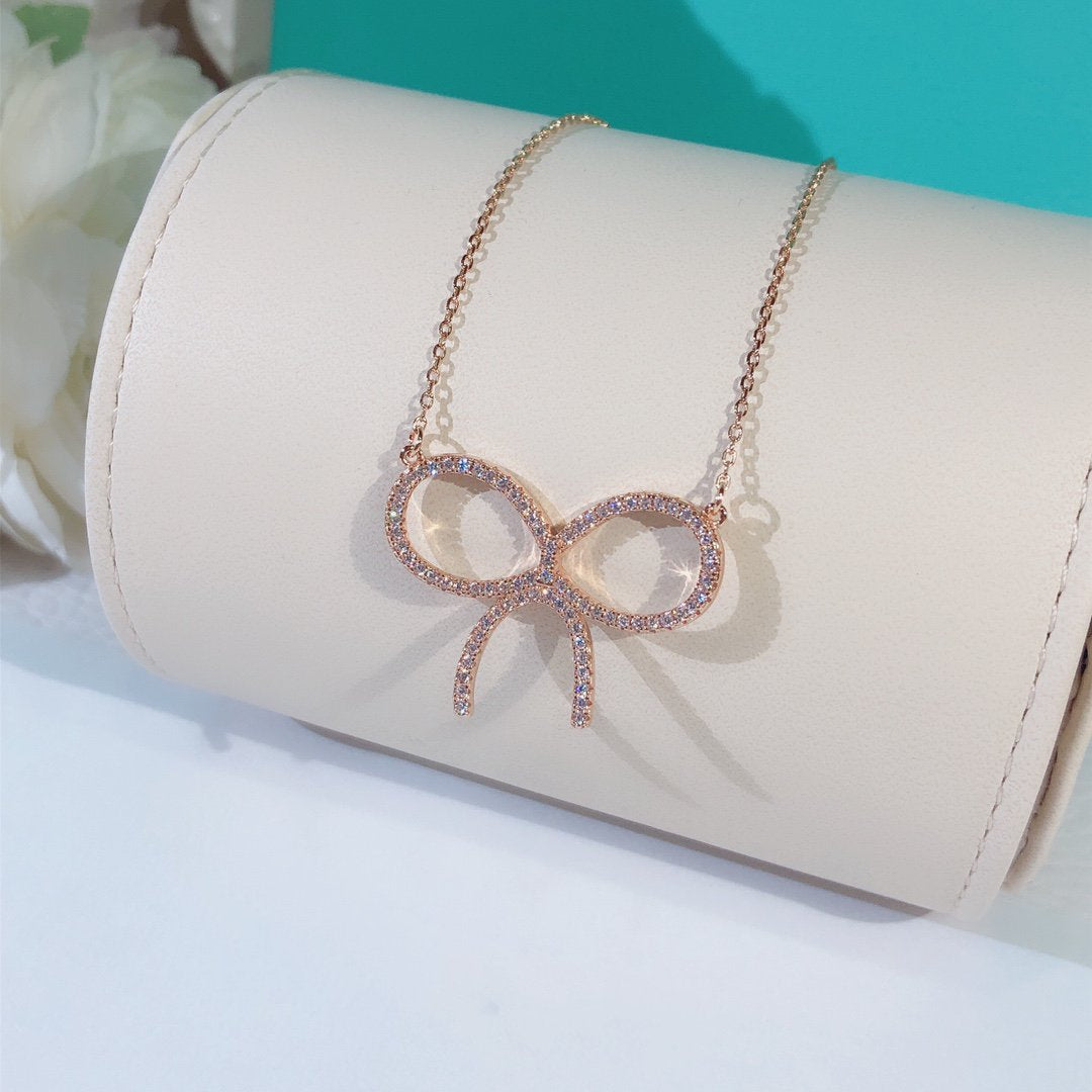 [Regalia Jewels]CLAW SET RHODIUM PLATED BOW NECKLACE