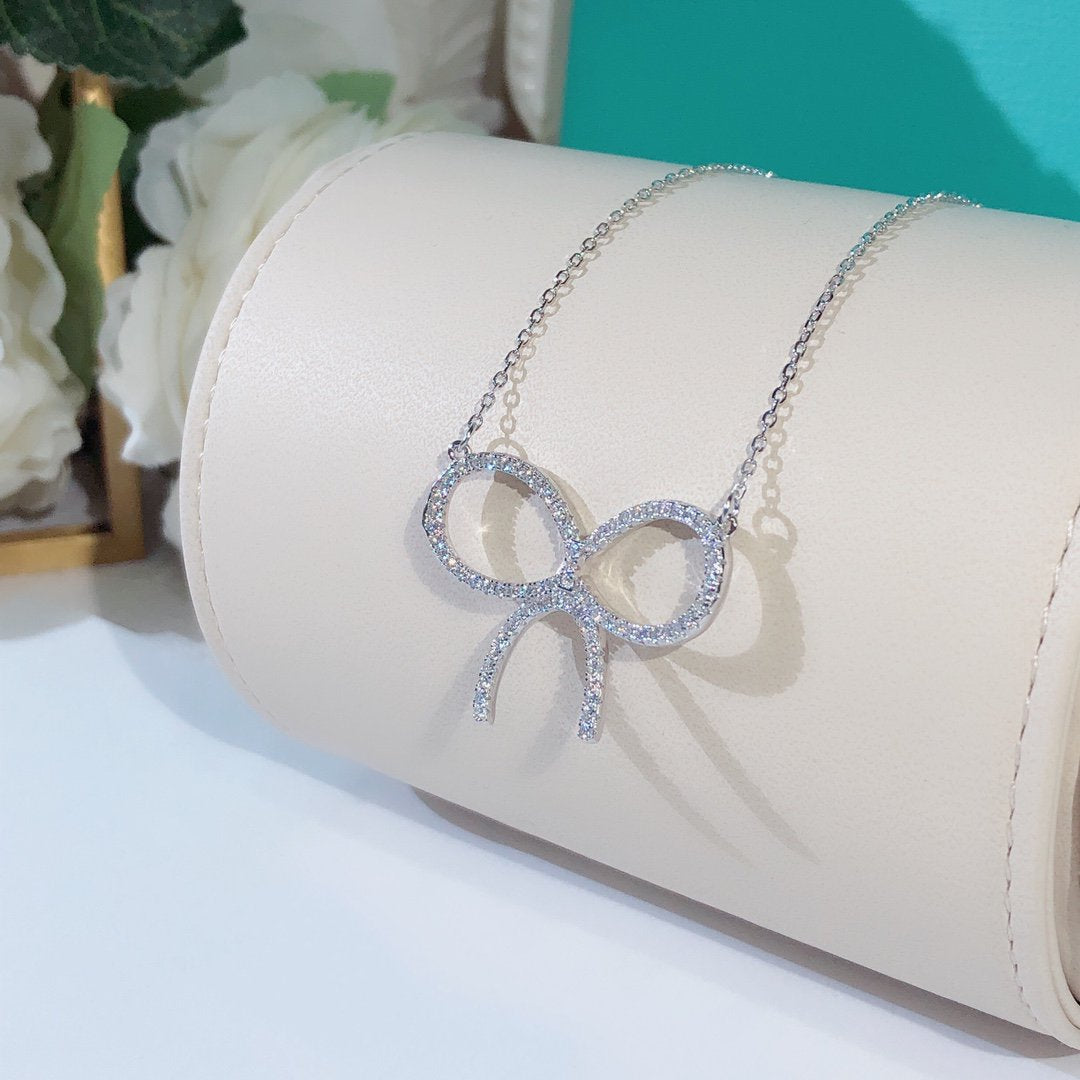[Regalia Jewels]CLAW SET RHODIUM PLATED BOW NECKLACE