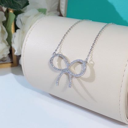 [Regalia Jewels]CLAW SET RHODIUM PLATED BOW NECKLACE