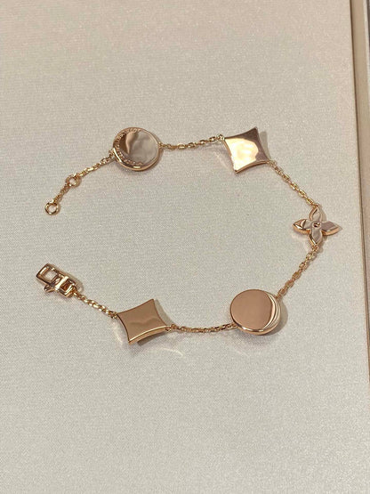 [Regalia Jewelry]STAR AND SUN 5 MOTIF MOP PINK GOLD BRACELET